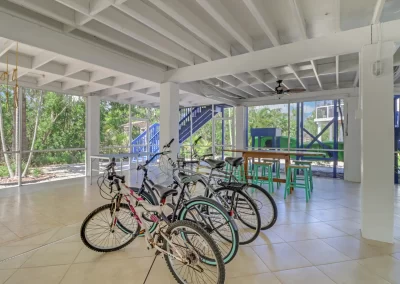 Flamingo Harbor screened patio area with bicycles, table and chairs