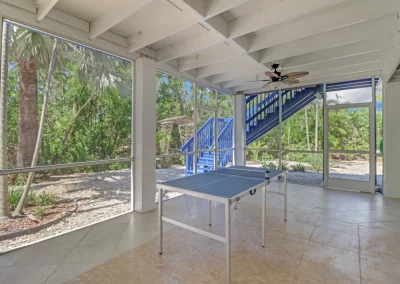 Flamingo Harbor screened patio table tennis