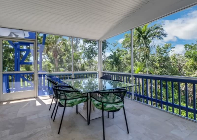 Flamingo Harbor screened veranda dining area